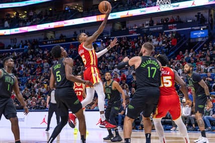 Nov 4, 2023; New Orleans, Louisiana, USA;  Atlanta Hawks guard Dejounte Murray (5) drives to the basket against New Orleans Pelicans forward Herbert Jones (5) during the first half at Smoothie King Center. Mandatory Credit: Stephen Lew-USA TODAY Sports