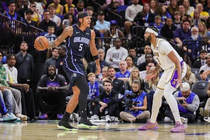 Nov 4, 2023; Orlando, Florida, USA; Orlando Magic forward Paolo Banchero (5) looks to pass against Los Angeles Lakers forward Anthony Davis (3) during the first quarter at Amway Center. Mandatory Credit: Mike Watters-USA TODAY Sports