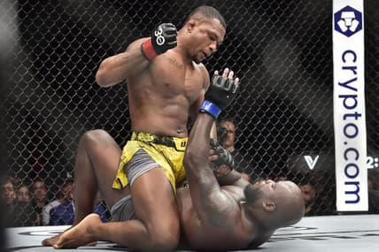 Nov 4, 2023; Sao Paulo, Brazil; Jailton Almeida (red gloves) fights Derrick Lewis (blue gloves) during UFC Fight Night at Ibirapuera Arena. Mandatory Credit: Jason da Silva-USA TODAY Sports