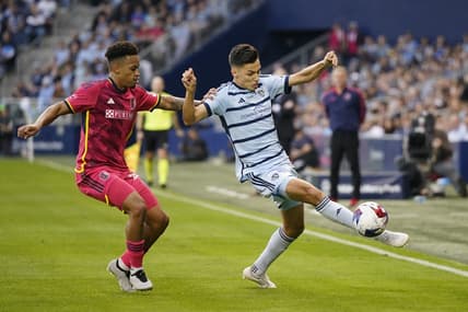 Nov 5, 2023; Kansas City, KS, USA; Sporting Kansas City forward Daniel Salloi (20) plays the ball defended by St. Louis City SC defender Akil Watts (20) in the first half of game two in a round one match of the 2023 MLS Cup Playoffs at Children's Mercy Park. Mandatory Credit: Jay Biggerstaff-USA TODAY Sports