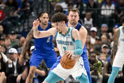 Nov 5, 2023; Dallas, Texas, USA; Dallas Mavericks guard Luka Doncic (77) attempts to knock the ball away from Charlotte Hornets guard LaMelo Ball (1) during the second quarter at the American Airlines Center. Mandatory Credit: Jerome Miron-USA TODAY Sports