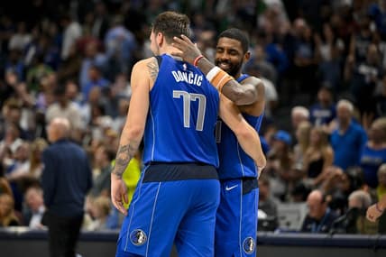 Nov 5, 2023; Dallas, Texas, USA; Dallas Mavericks guard Kyrie Irving (11) hugs guard Luka Doncic (77) during the second half against the Charlotte Hornets at the American Airlines Center. Mandatory Credit: Jerome Miron-USA TODAY Sports