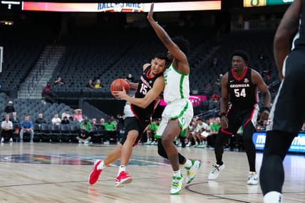 Nov 6, 2023; Las Vegas, Nevada, USA; Georgia Bulldogs guard RJ Melendez (15) drives against Oregon Ducks guard Jermaine Couisnard (5) during the second half at T-Mobile Arena. Mandatory Credit: Stephen R. Sylvanie-USA TODAY Sports