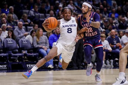Nov 6, 2023; Cincinnati, Ohio, USA; Xavier Musketeers guard Quincy Olivari (8) drives to the basket against Robert Morris Colonials guard Josh Corbin (32) in the first half at Cintas Center. Mandatory Credit: Katie Stratman-USA TODAY Sports
