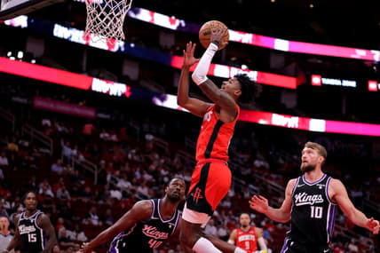 Nov 6, 2023; Houston, Texas, USA; Houston Rockets guard Jalen Green (4) makes a layup against the Sacramento Kings during the first quarter at Toyota Center. Mandatory Credit: Erik Williams-USA TODAY Sports