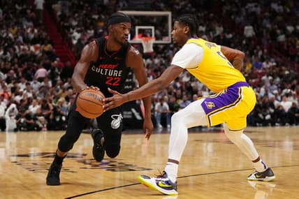 Nov 6, 2023; Miami, Florida, USA; Miami Heat forward Jimmy Butler (22) drives the ball around Los Angeles Lakers forward Cam Reddish (5) during the first half at Kaseya Center. Mandatory Credit: Jasen Vinlove-USA TODAY Sports