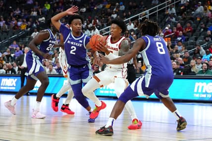 Nov 6, 2023; Las Vegas, Nevada, USA; USC Trojans guard Boogie Ellis (5) passes the ball between Kansas State Wildcats guard Tylor Perry (2) and Kansas State Wildcats guard R.J. Jones (8) during the first half at T-Mobile Arena. Mandatory Credit: Stephen R. Sylvanie-USA TODAY Sports