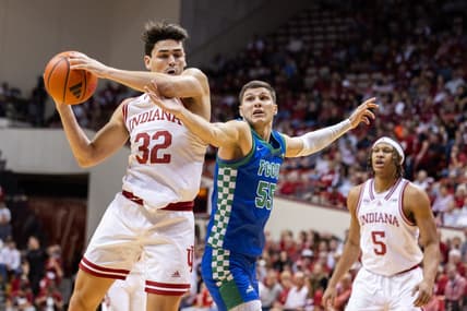 Nov 7, 2023; Bloomington, Indiana, USA; Indiana Hoosiers guard Trey Galloway (32) shoots against Florida Gulf Coast Eagles guard Chase Johnston (55) in the first half at Simon Skjodt Assembly Hall. Mandatory Credit: Trevor Ruszkowski-USA TODAY Sports