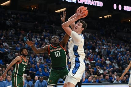 Nov 7, 2023; Omaha, Nebraska, USA; Creighton Bluejays center Ryan Kalkbrenner (11) drives against Florida A&M Rattlers forward Chase Barrs (10) in the second half at CHI Health Center Omaha. Mandatory Credit: Steven Branscombe-USA TODAY Sports