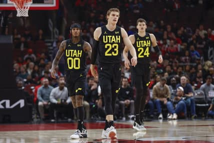 Nov 6, 2023; Chicago, Illinois, USA; Utah Jazz forward Lauri Markkanen (23), Utah Jazz guard Jordan Clarkson (00) and Utah Jazz center Walker Kessler (24) walk on the court during the first half of a basketball game against the Chicago Bulls at United Center. Mandatory Credit: Kamil Krzaczynski-USA TODAY Sports
