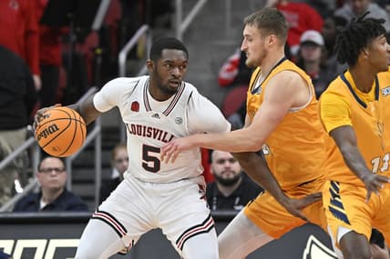 Nov 10, 2023; Louisville, Kentucky, USA; Louisville Cardinals forward Brandon Huntley-Hatfield (5) posts up against Chattanooga Mocs forward Jan Zidek (20) during the first half at KFC Yum! Center. Mandatory Credit: Jamie Rhodes-USA TODAY Sports