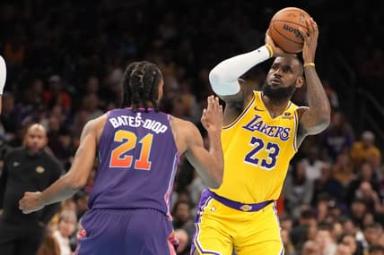 Nov 10, 2023; Phoenix, Arizona, USA; Los Angeles Lakers forward LeBron James (23) shoots against Phoenix Suns forward Keita Bates-Diop (21) in the first half at Footprint Center. Mandatory Credit: Rick Scuteri-USA TODAY Sports