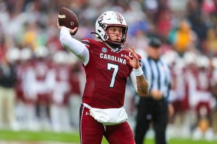 Nov 11, 2023; Columbia, South Carolina, USA; South Carolina Gamecocks quarterback Spencer Rattler (7) throws for a touchdown against the Vanderbilt Commodores in the first quarter at Williams-Brice Stadium. Mandatory Credit: Jeff Blake-USA TODAY Sports