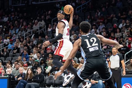 Nov 11, 2023; Atlanta, Georgia, USA; Miami Heat center Bam Adebayo (13) saves the ball from going out of bounds against Atlanta Hawks forward De'Andre Hunter (12) during the first quarter at State Farm Arena. Mandatory Credit: Jordan Godfree-USA TODAY Sports
