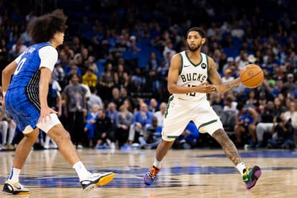 Nov 11, 2023; Orlando, Florida, USA; Milwaukee Bucks guard Cameron Payne (15) passes the ball past Orlando Magic guard Anthony Black (0) during the second half at Amway Center. Mandatory Credit: Matt Pendleton-USA TODAY Sports