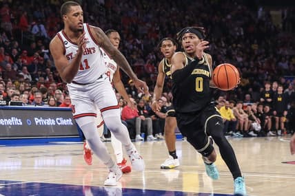 Nov 13, 2023; New York, New York, USA; Michigan Wolverines guard Dug McDaniel (0) drives past St. John's Red Storm center Joel Soriano (11) in the first half at Madison Square Garden. Mandatory Credit: Wendell Cruz-USA TODAY Sports