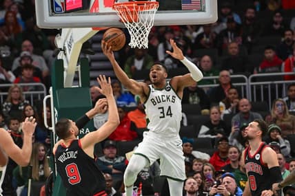 Nov 13, 2023; Milwaukee, Wisconsin, USA; Milwaukee Bucks forward Giannis Antetokounmpo (34) takes a shot against Chicago Bulls center Nikola Vucevic (9) in the first quarter at Fiserv Forum. Mandatory Credit: Benny Sieu-USA TODAY Sports