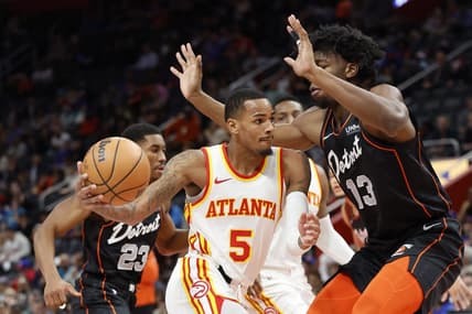 Nov 14, 2023; Detroit, Michigan, USA; Atlanta Hawks guard Dejounte Murray (5) dribbles defended by Detroit Pistons center James Wiseman (13) in the first half at Little Caesars Arena. Mandatory Credit: Rick Osentoski-USA TODAY Sports