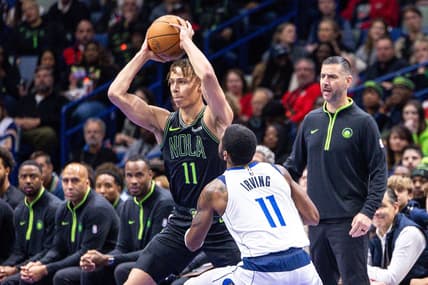Nov 14, 2023; New Orleans, Louisiana, USA;  New Orleans Pelicans guard Dyson Daniels (11) looks to pass the ball against Dallas Mavericks guard Kyrie Irving (11) with acting head coach James Borrego looks on during the first half at the Smoothie King Center. Mandatory Credit: Stephen Lew-USA TODAY Sports