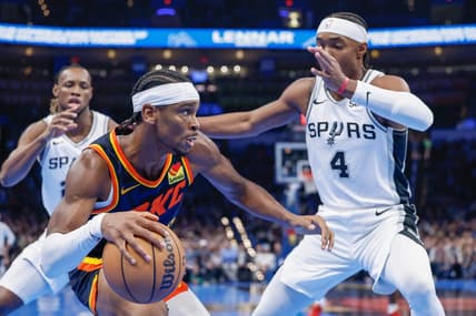 Nov 14, 2023; Oklahoma City, Oklahoma, USA; Oklahoma City Thunder guard Shai Gilgeous-Alexander (2) drives against San Antonio Spurs guard Devonte' Graham (4) during the second half at Paycom Center. Mandatory Credit: Alonzo Adams-USA TODAY Sports
