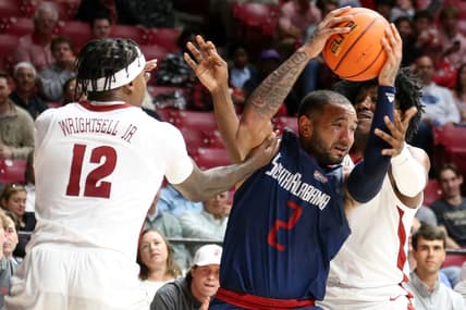 Nov 14, 2023; Tuscaloosa, Alabama, USA; South Alabama guard Isiah Gaiter (2) fights for the ball against Alabama guard Latrell Wrightsell Jr. (12) and guard Davin Cosby Jr. (4) during the second half Coleman Coliseum. Mandatory Credit: Gary Cosby Jr.-USA TODAY Sports