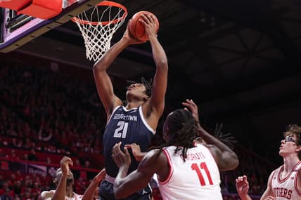 Nov 15, 2023; Piscataway, New Jersey, USA; Georgetown Hoyas center Ryan Mutombo (21) goes to the basket in front of Rutgers Scarlet Knights center Clifford Omoruyi (11) and guard Gavin Griffiths (10) during the first half at Jersey Mike's Arena. Mandatory Credit: Vincent Carchietta-USA TODAY Sports