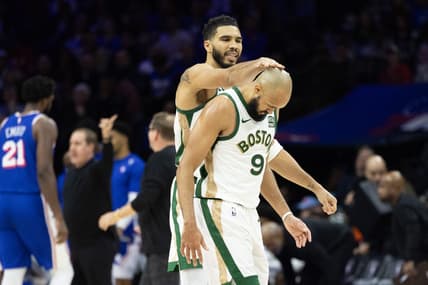 Nov 15, 2023; Philadelphia, Pennsylvania, USA; Boston Celtics forward Jayson Tatum (0) congratulates guard Derrick White (9) after his three pointer against the Philadelphia 76ers during the fourth quarter at Wells Fargo Center. Mandatory Credit: Bill Streicher-USA TODAY Sports