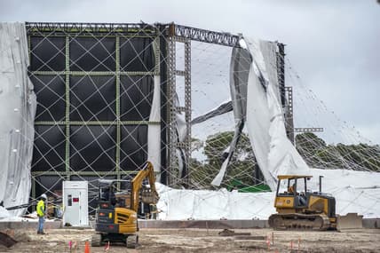 Nov 16, 2023; PALM BEACH GARDENS, FL, USA;  The air-supported dome for the future home of the TGL indoor golf league founded by Tiger Woods and Rory McIlroy  was damaged and deflated Tuesday night after a temporary power system outage at the site. There were no injuries, and no technology was damaged in Palm Beach Gardens, Florida.at . Mandatory Credit: Greg Lovett-USA TODAY