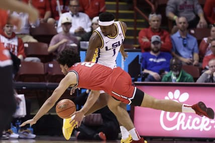 Nov 16, 2023; Charleston, South Carolina, USA;  LSU Tigers guard Carlos Stewart (1) and Dayton Flyers forward Nate Santos (2) scramble for a ball in the first half at TD Arena. Mandatory Credit: David Yeazell-USA TODAY Sports