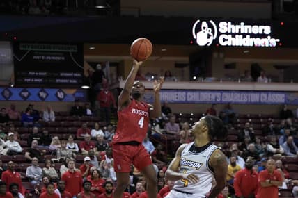Nov 16, 2023; Charleston, South Carolina, USA; Houston Cougars guard LJ Cryer (4) shoots the ball over Towson Tigers guard Dylan Williamson (4) in the second half at TD Arena. Mandatory Credit: David Yeazell-USA TODAY Sports