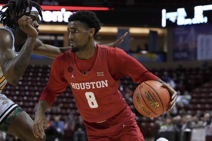 Nov 16, 2023; Charleston, South Carolina, USA; Houston Cougars guard Mylik Wilson (8) drives the ball in the second half against the Towson Tigers at TD Arena. Mandatory Credit: David Yeazell-USA TODAY Sports