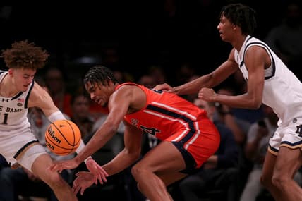 Nov 16, 2023; Brooklyn, New York, USA; Auburn Tigers center Dylan Cardwell (44) fights for the ball against Notre Dame Fighting Irish guard Braeden Shrewsberry (11) and forward Carey Booth (0) during the first half at Barclays Center. Mandatory Credit: Brad Penner-USA TODAY Sports