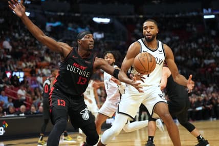 Nov 16, 2023; Miami, Florida, USA; Miami Heat center Bam Adebayo (13) tips the ball away from Brooklyn Nets forward Mikal Bridges (1) in the second half at Kaseya Center. Mandatory Credit: Jim Rassol-USA TODAY Sports