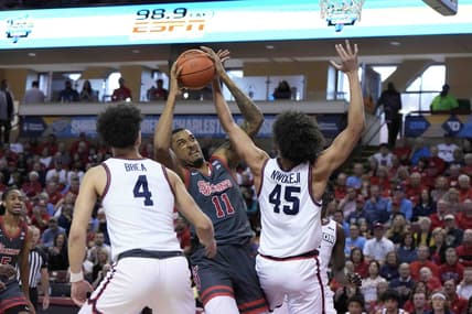 Nov 17, 2023; Charleston, SC, USA; St. John's Red Storm center Joel Soriano (11) is fouled by Dayton Flyers forward Zimi Nwokeji (45) in the first half at TD Arena. Mandatory Credit: David Yeazell-USA TODAY Sports