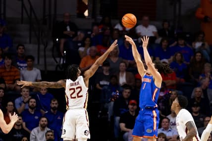 Nov 17, 2023; Gainesville, Florida, USA; Florida Gators guard Walter Clayton Jr. (1) shoots over Florida State Seminoles guard Darin Green Jr. (22) during the first half at Exactech Arena at the Stephen C. O'Connell Center. Mandatory Credit: Matt Pendleton-USA TODAY Sports