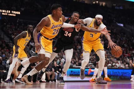 Nov 17, 2023; Portland, Oregon, USA; Portland Trail Blazers forward Jabari Walker (34) and Los Angeles Lakers power forward Rui Hachimura (28) and Anthony Davis (3) go after a loose ball during the first half at Moda Center. Mandatory Credit: Soobum Im-USA TODAY Sports