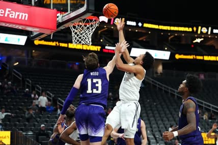 Nov 17, 2023; Las Vegas, Nevada, USA; Xavier Musketeers guard Desmond Claude (1) shoots against Washington Huskies forward Moses Wood (13) during the second half at T-Mobile Arena. Mandatory Credit: Stephen R. Sylvanie-USA TODAY Sports