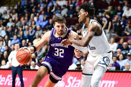 Nov 18, 2023; Uncasville, Connecticut, USA; Northwestern Wildcats forward Blake Preston (32) dribbles the ball defended by Rhode Island Rams guard Luis Kortright (1) during the second half at Mohegan Sun Arena. Mandatory Credit: Mark Smith-USA TODAY Sports