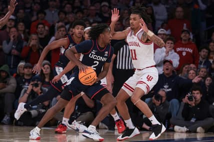 Nov 19, 2023; New York, New York, USA; Connecticut Huskies guard Tristen Newton (2) dribbles as Indiana Hoosiers guard CJ Gunn (11) defends during the second half at Madison Square Garden. Mandatory Credit: Vincent Carchietta-USA TODAY Sports