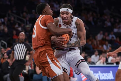 Nov 19, 2023; New York, New York, USA; Texas Longhorns guard Max Abmas (3) ties up Louisville Cardinals guard Tre White (22) during the second half at Madison Square Garden. Mandatory Credit: Vincent Carchietta-USA TODAY Sports