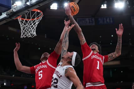 Nov 20, 2023; New York, NY, USA; Louisville Cardinals guard Tre White (22) rebounds against Indiana Hoosiers forward Malik Reneau (5) and center Kel'el Ware (1) during the first half at Madison Square Garden. Mandatory Credit: Vincent Carchietta-USA TODAY Sports