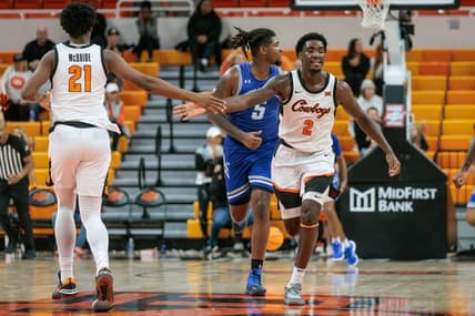Nov 20, 2023; Stillwater, Oklahoma, USA; Oklahoma State Cowboys forward Justin McBride (21) and forward Eric Dailey Jr. (2) slap hands after a play during the second half against the New Orleans Privateers at Gallagher-Iba Arena. Mandatory Credit: William Purnell-USA TODAY Sports