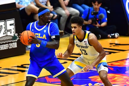 Nov 20, 2023; Honolulu, Hawaii, USA;  UCLA Bruins forward Adem Bona (3) is defended by Marquette Golden Eagles forward Oso Ighodaro (13) during the second period at SimpliFi Arena at Stan Sheriff Center. Mandatory Credit: Steven Erler-USA TODAY Sports