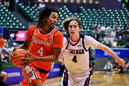 Nov 21, 2023; Honolulu, HI, USA;  Syracuse Orange forward Chris Bell (4) drives to the basket defended by Gonzaga Bulldogs guard Dusty Stromer (4) during the first period at SimpliFi Arena at Stan Sheriff Center. Mandatory Credit: Steven Erler-USA TODAY Sports