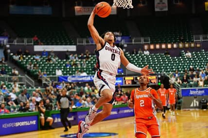 Nov 21, 2023; Honolulu, HI, USA;  Gonzaga Bulldogs guard Ryan Nembhard (0) drives to the basket as Syracuse Orange guard JJ Starling (2) looks on during the second half at SimpliFi Arena at Stan Sheriff Center. Mandatory Credit: Steven Erler-USA TODAY Sports