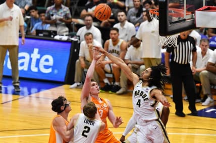 Nov 21, 2023; Honolulu, HI, USA; Tennessee Volunteers guard Dalton Knecht (3) attempts a shot defended by Purdue Boilermakers forward Trey Kaufman-Renn (4) during the first period at SimpliFi Arena at Stan Sheriff Center. Mandatory Credit: Steven Erler-USA TODAY Sports