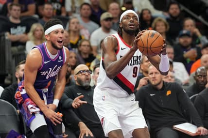 Nov 21, 2023; Phoenix, Arizona, USA; Phoenix Suns guard Devin Booker (1) shouts from the bench as Portland Trail Blazers forward Jerami Grant (9) shoots during the second half at Footprint Center. Mandatory Credit: Joe Camporeale-USA TODAY Sports