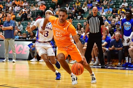 Nov 22, 2023; Honolulu, HI, USA;  Tennessee Volunteers guard Santiago Vescovi (25) drives around Kansas Jayhawks guard Dajuan Harris Jr. (3) during the first half at SimpliFi Arena at Stan Sheriff Center. Mandatory Credit: Steven Erler-USA TODAY Sports
