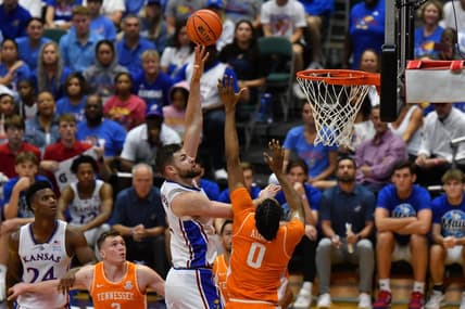 Nov 22, 2023; Honolulu, HI, USA;  Kansas Jayhawks center Hunter Dickinson (1) shoots the ball while defended by Tennessee Volunteers forward Jonas Aidoo (0) during the second half at SimpliFi Arena at Stan Sheriff Center. Mandatory Credit: Steven Erler-USA TODAY Sports