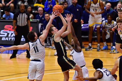 Nov 22, 2023; Honolulu, HI, USA; Purdue Boilermakers guard Fletcher Loyer (2) shoots the ball while defended by Marquette Golden Eagles guard Tyler Kolek (11) and guard Chase Ross (2) during the first period at SimpliFi Arena at Stan Sheriff Center. Mandatory Credit: Steven Erler-USA TODAY Sports